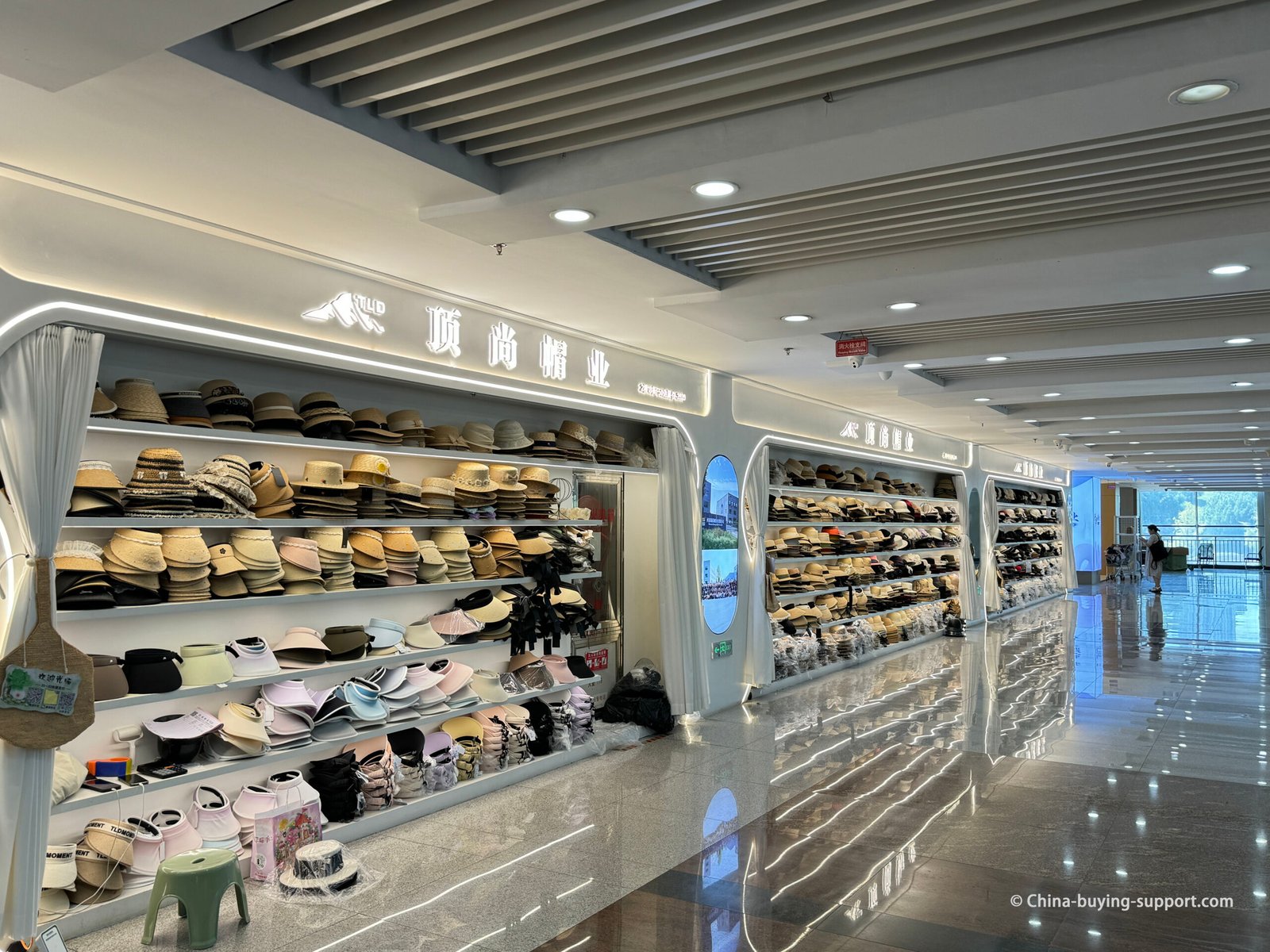 Display wall of summer hats and visors at District 4 hat wholesalers, at Hats Section in Yiwu Market, China