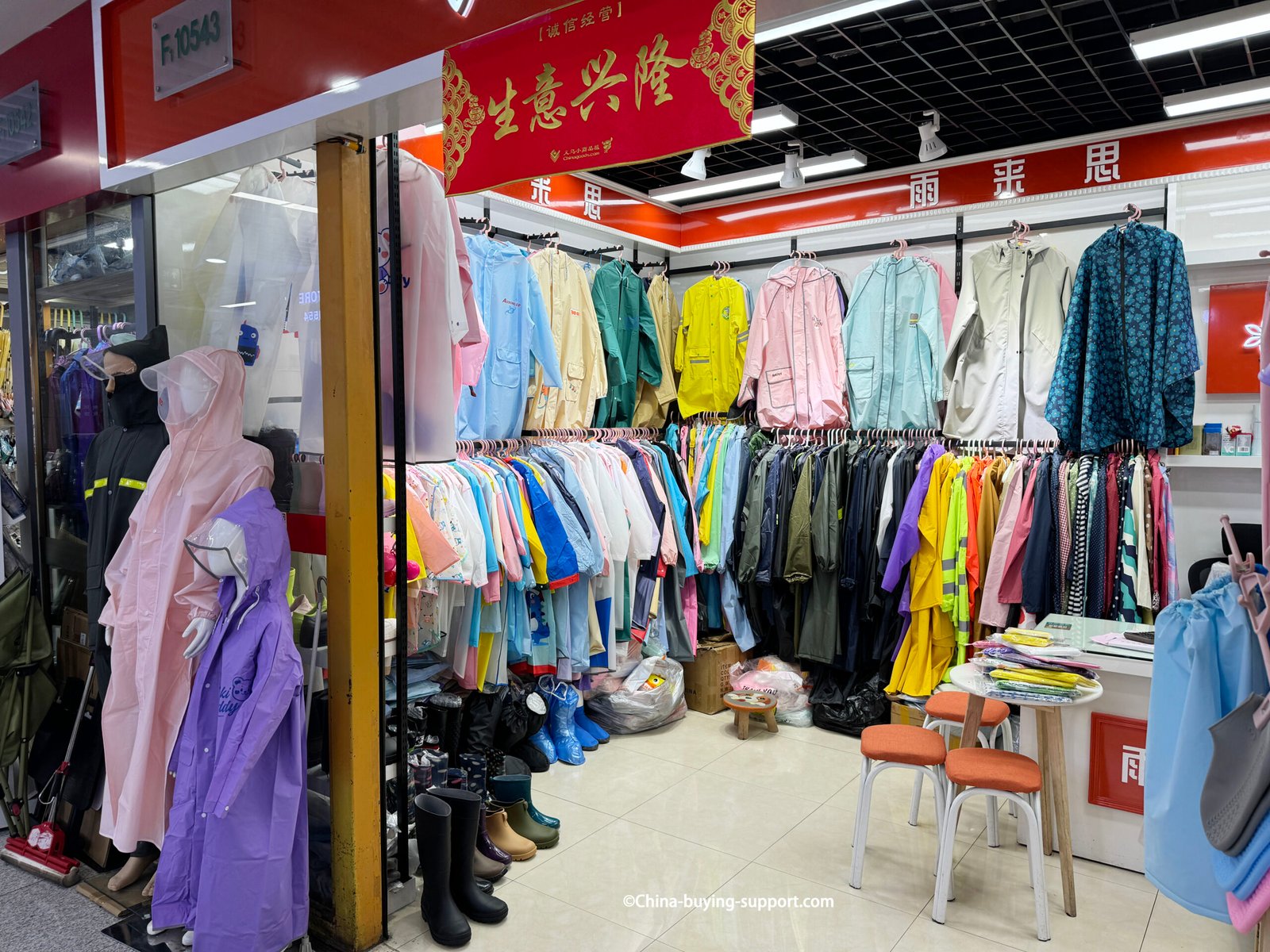 yiwu district 2 rainwear wholesale shop interior with kids and adult raincoats, mannequins, rubber boots
