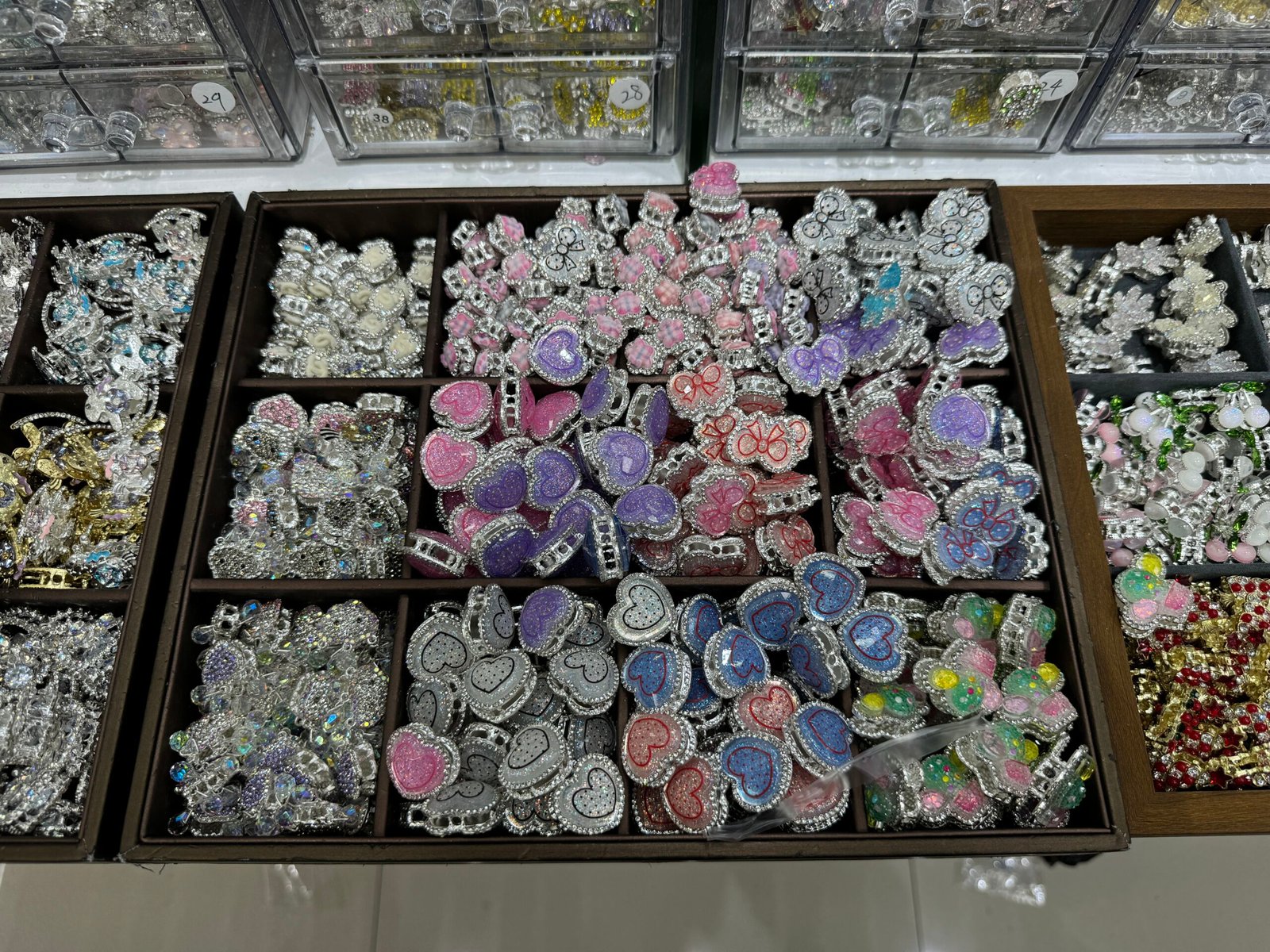 Assorted rhinestone heart and butterfly slider charms in pink, purple and blue, silver tone, Yiwu wholesale craft findings.