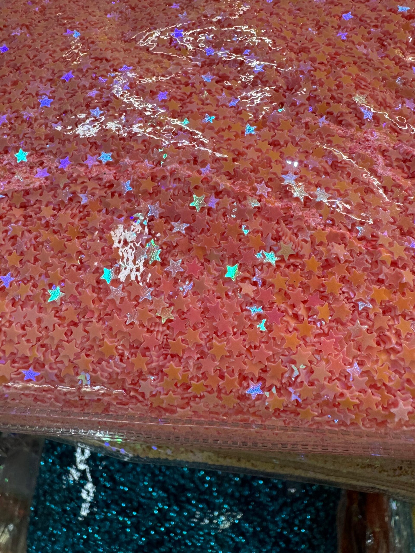 Close-up of pink iridescent star sequins (paillettes) from Yiwu E Area supplier.