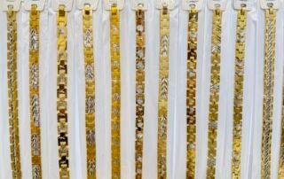 Close-up of copper gold plated bracelet chains in 7mm and 11mm widths for wholesale ready stock, in Yiwu Jewelry Market