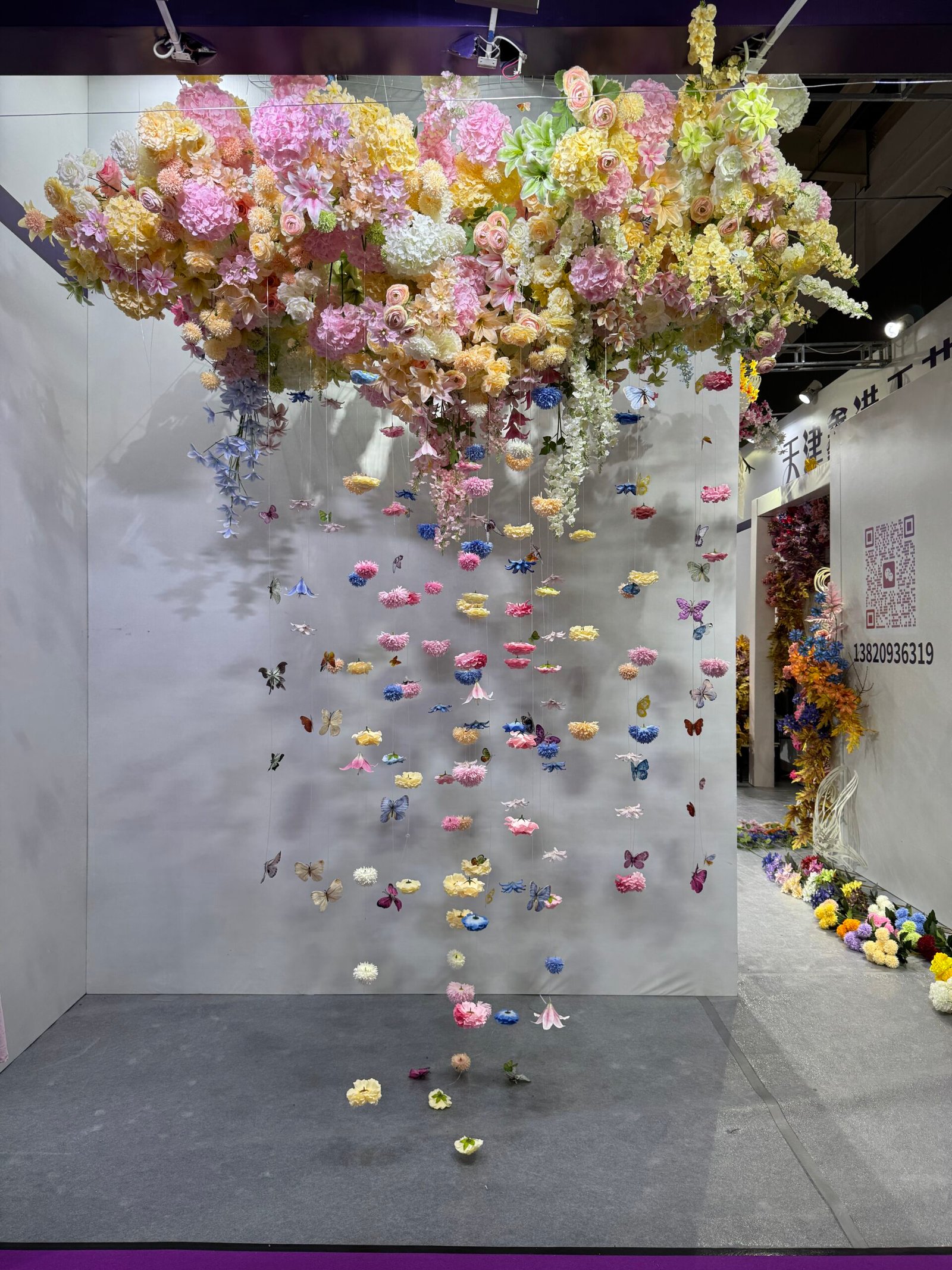 Hanging pastel floral and butterfly wedding installation at Yiwu wedding market