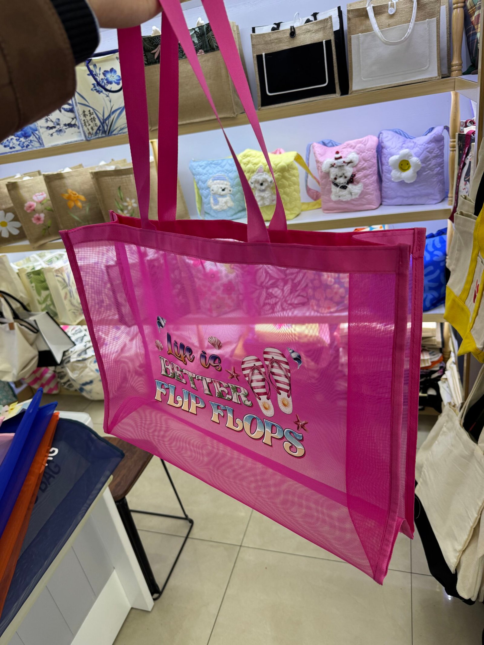Custom pink mesh tote bag with long handles transparent body side gusset and colorful flip flops logo print