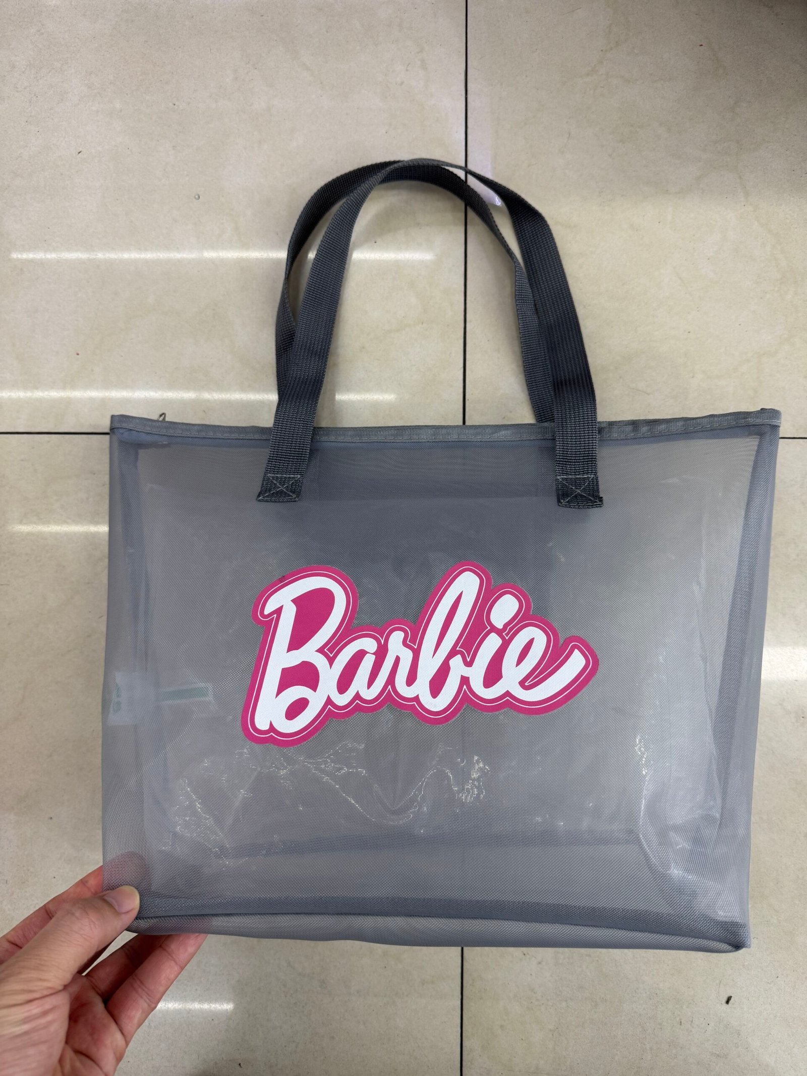 Gray custom nylon mesh tote bag with large logo print reinforced handles and structured bottom