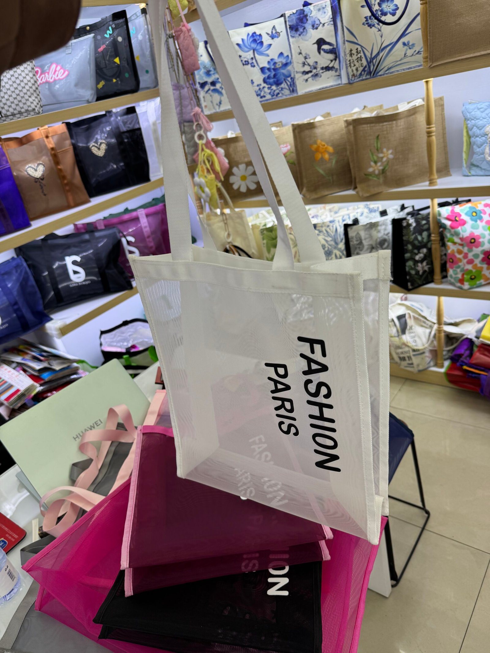 White custom nylon mesh tote bag with black Fashion Paris print and long shoulder handles