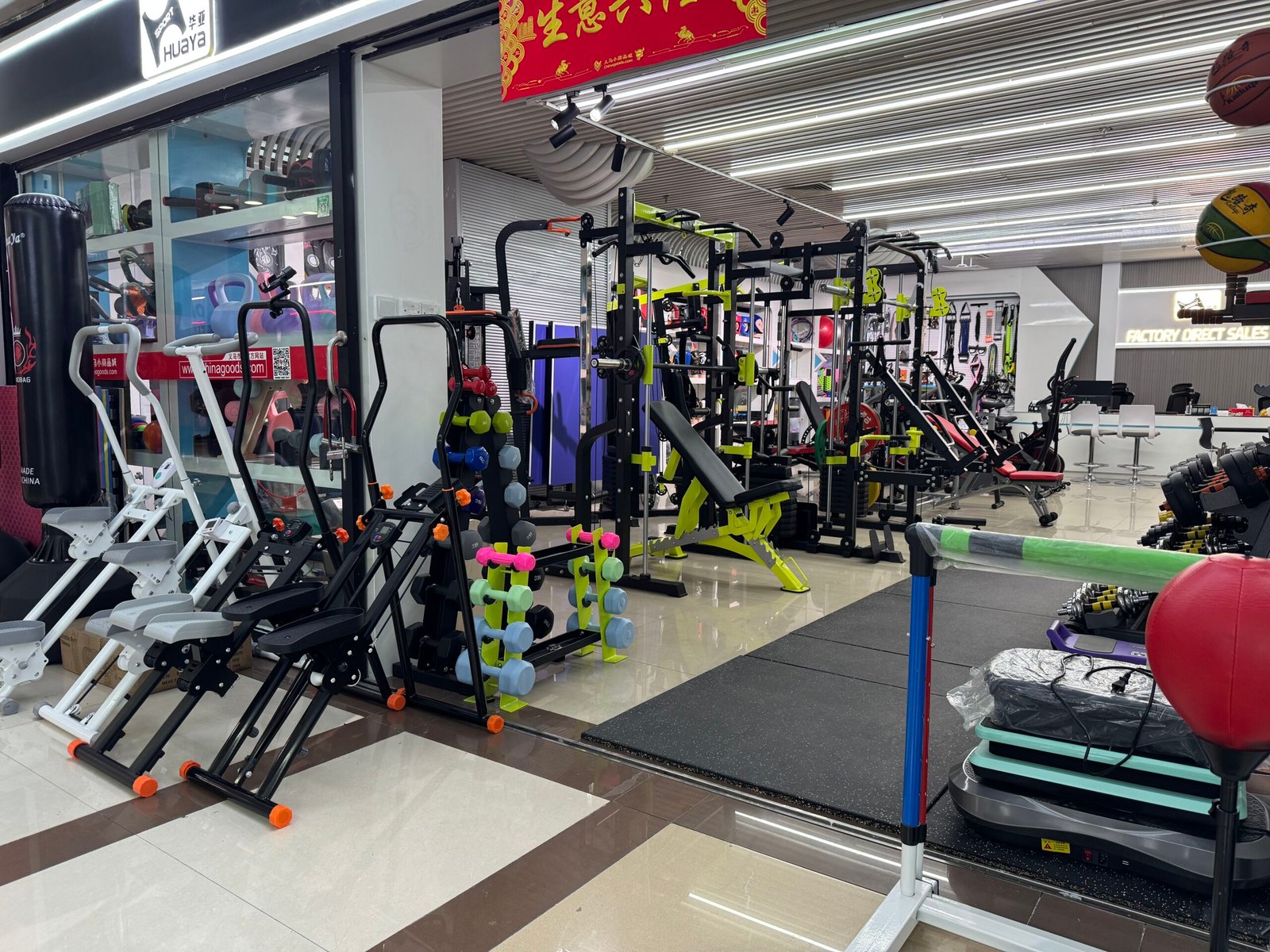 Fitness equipment showroom in Yiwu market with home gym machines and dumbbells