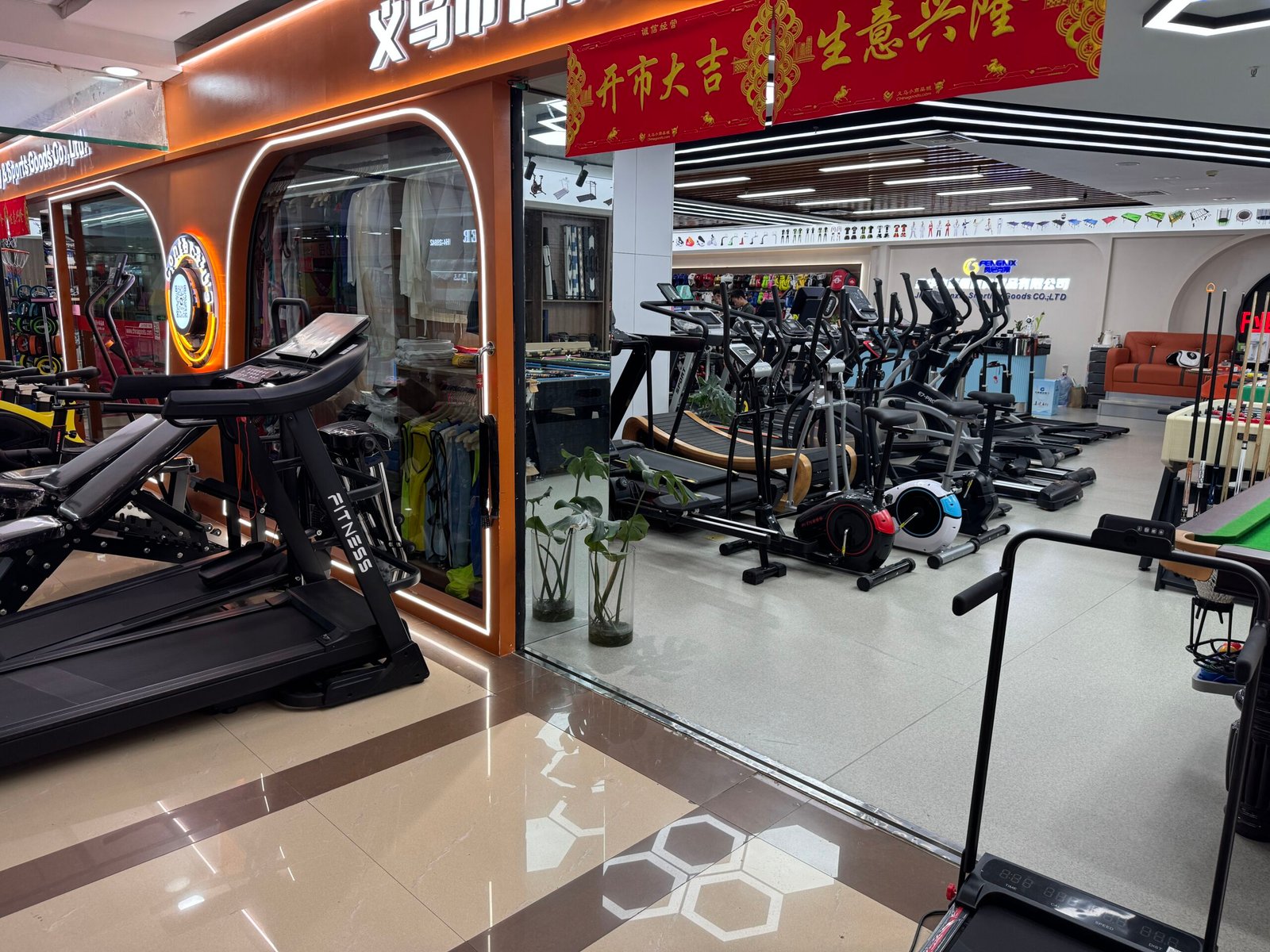 Cardio equipment showroom in Yiwu Sports Market with treadmills, ellipticals, and exercise bikes
