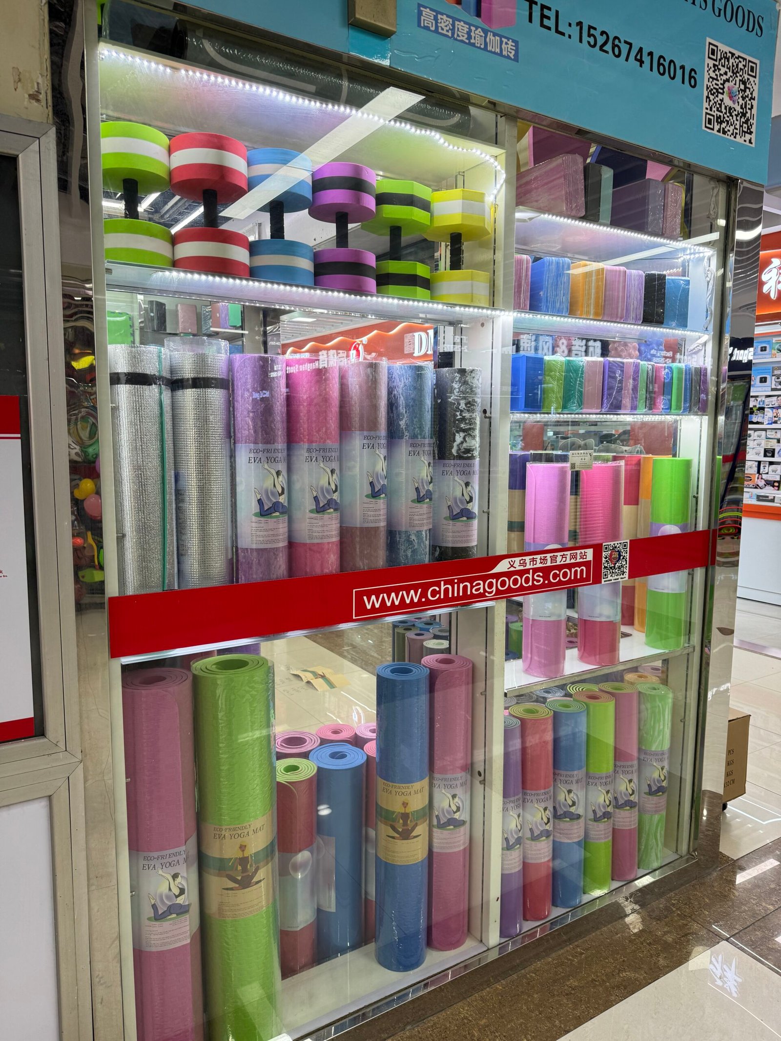 Yoga mats and foam rollers displayed in a Yiwu Sports Market shop