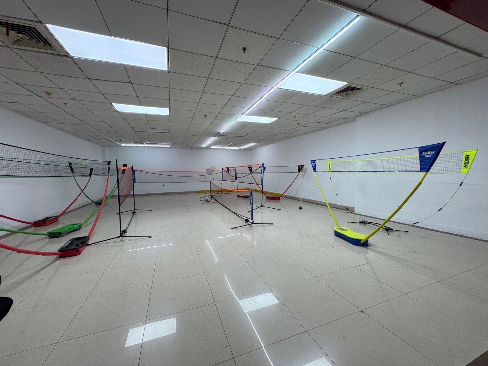 Portable badminton and pickleball nets displayed in a Yiwu wholesale market showroom