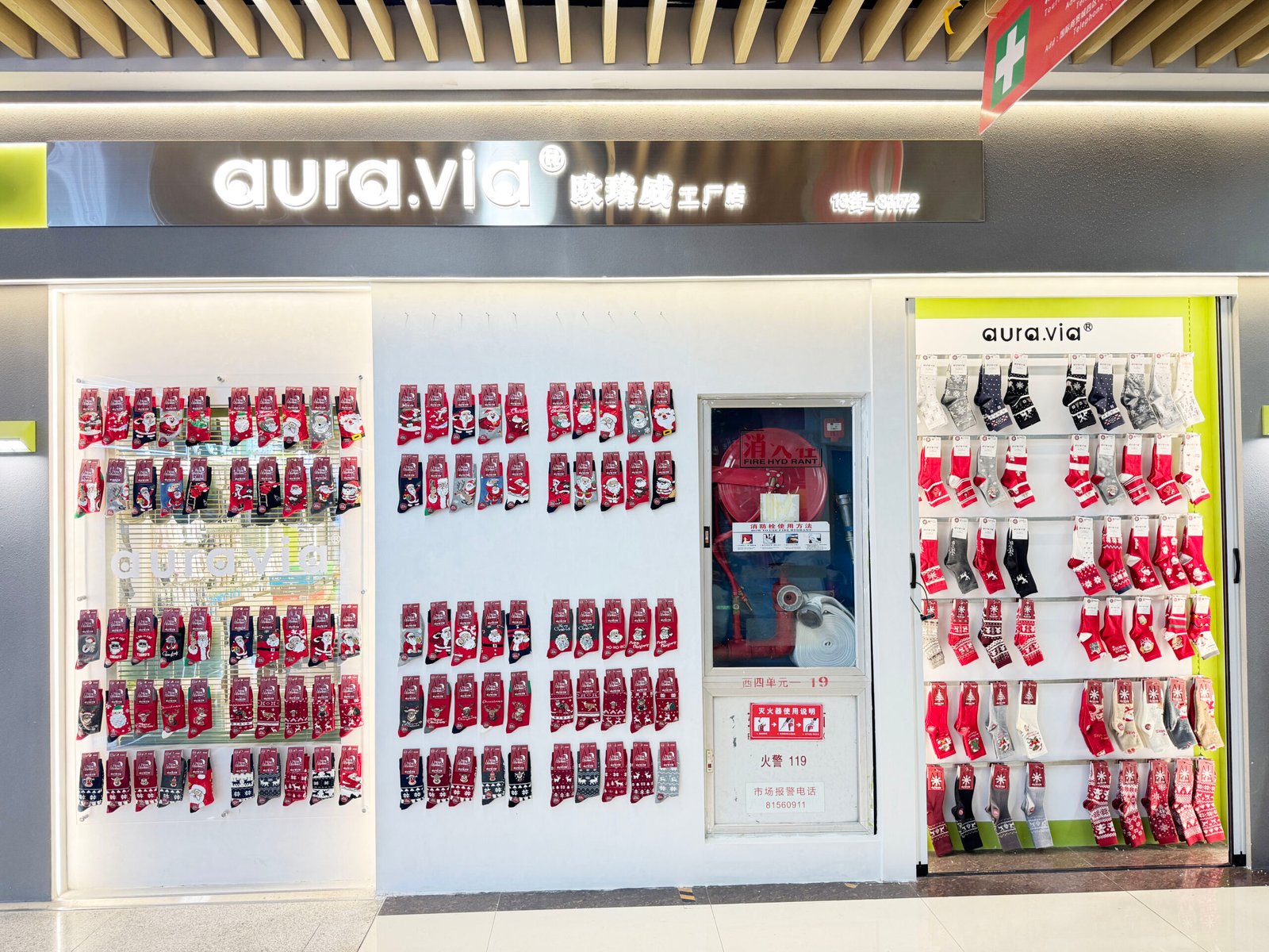 Red Christmas socks and festive winter designs displayed at a Yiwu wholesale sock supplier