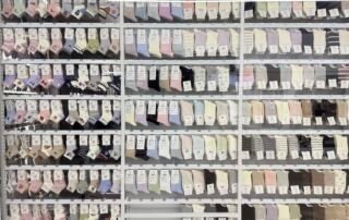 Long aisle of factory-direct sock suppliers and wholesale stores in the Yiwu sock market