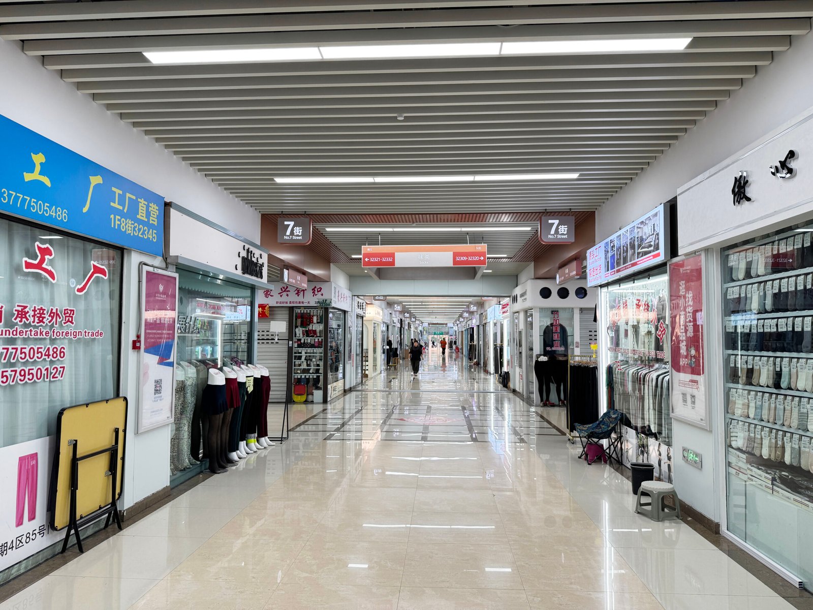 No. 7 Street corridor inside the Yiwu wholesale market with hosiery and sock supplier shops